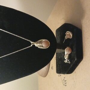 Genuine,Peach Moonstone, set in 925 solid sterling silver.Necklace and earrings.